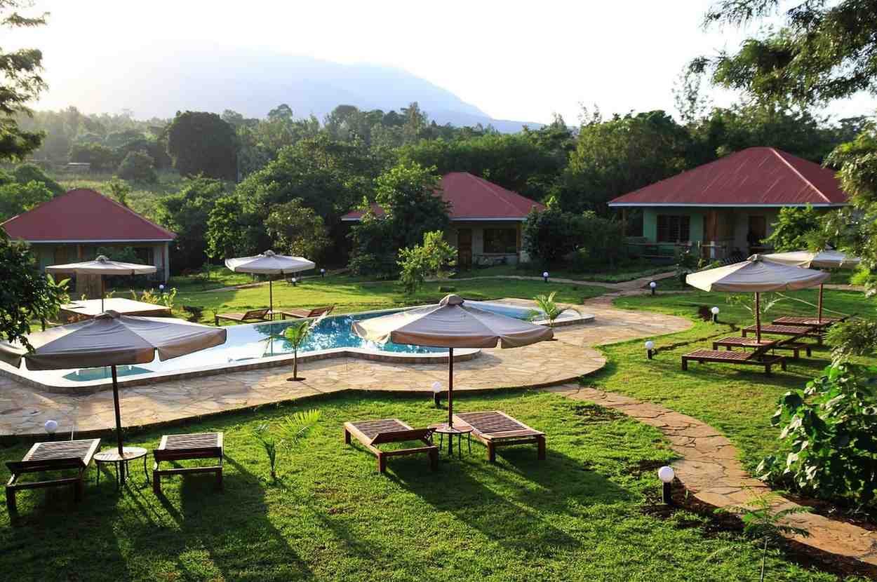 Bungalow terrace with Mount Meru views at African View Lodge