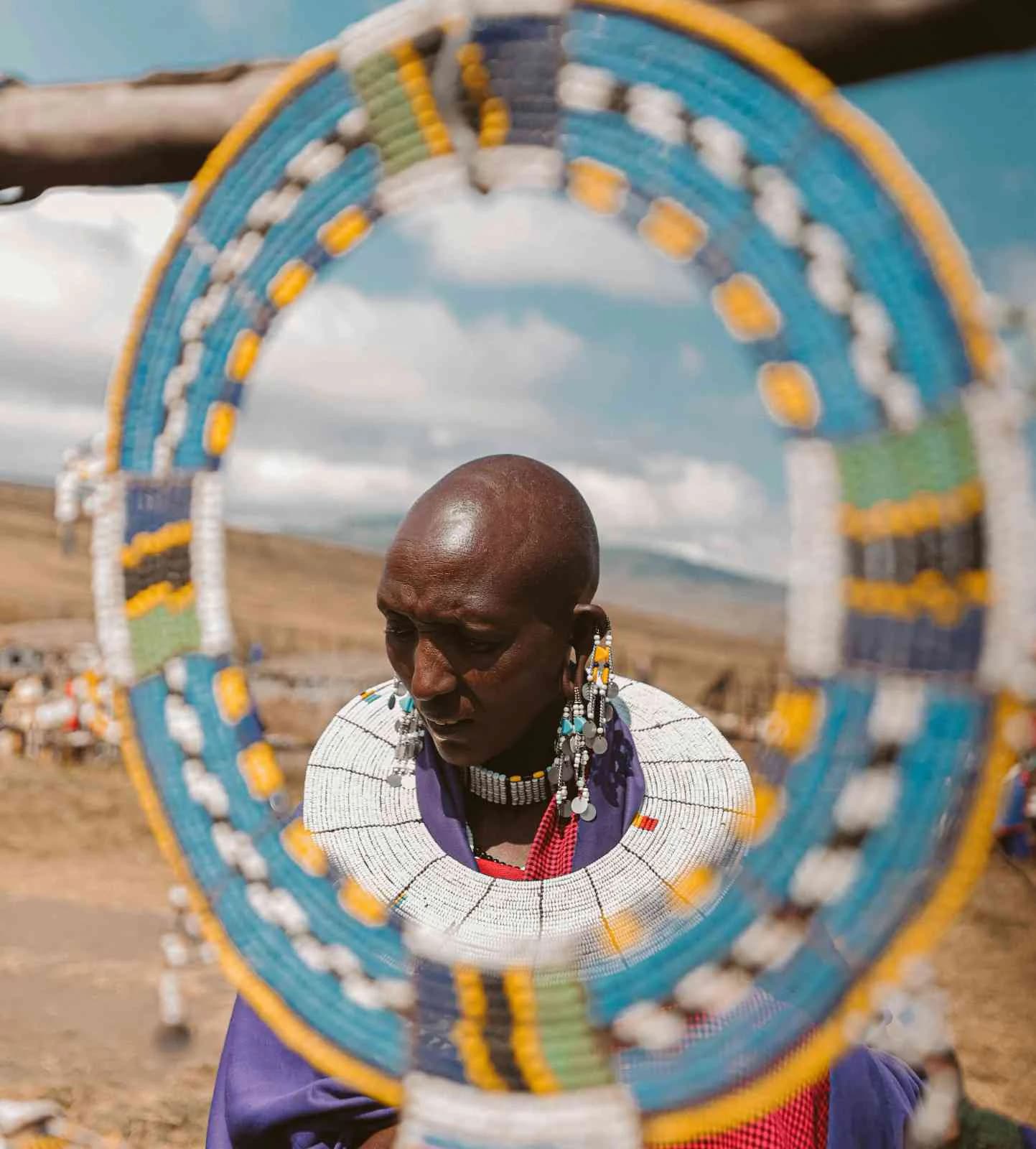Colorful Tanzanian craft market with beadwork and carvings
