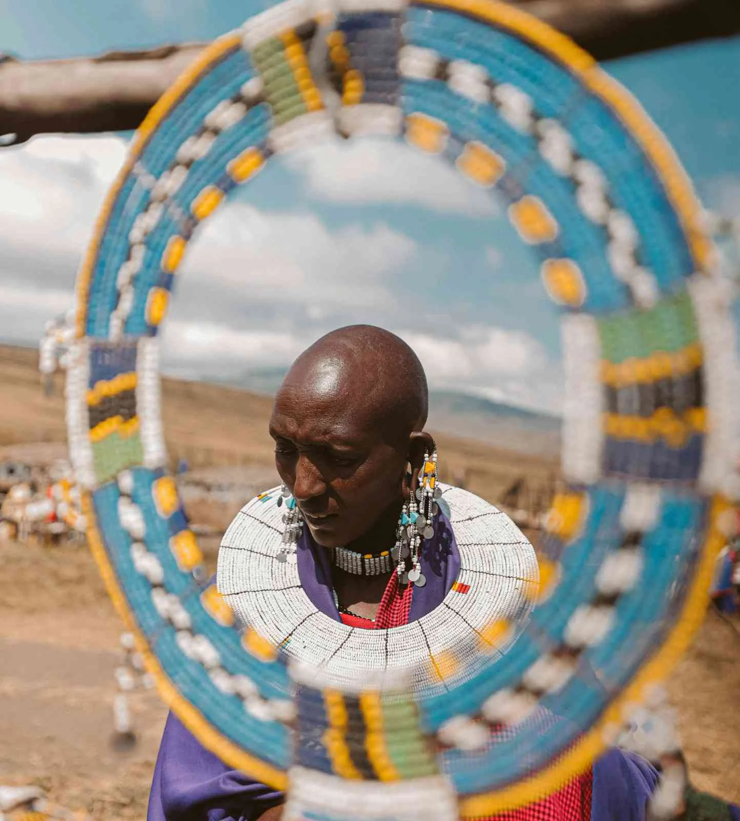 Colorful Tanzanian craft market with beadwork and carvings